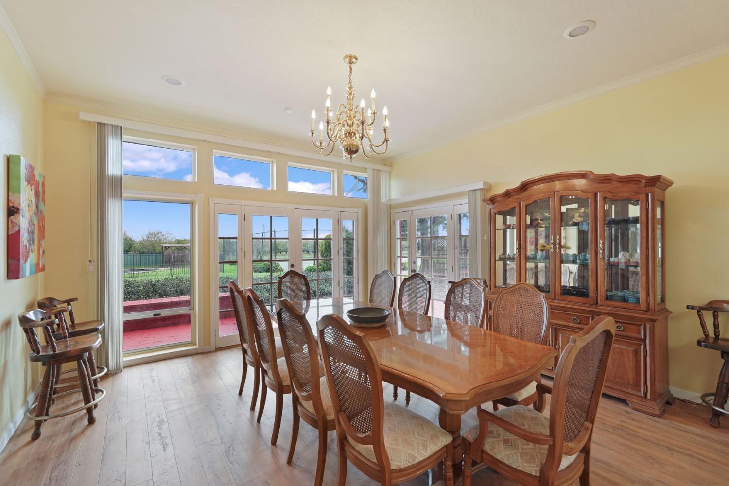 5766 Alpine Road Stockton, CA 95215 - Photo 52 of 99 a view of a dining room with furniture window and outside view