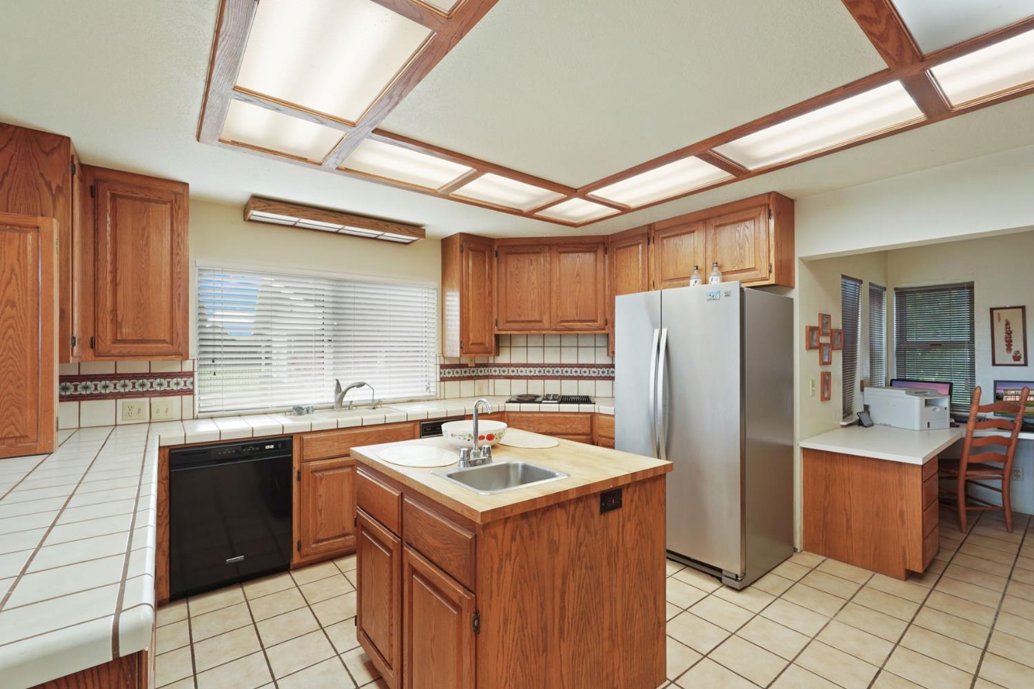 5766 Alpine Road Stockton, CA 95215 - Photo 54 of 99 a kitchen with a sink stove and refrigerator