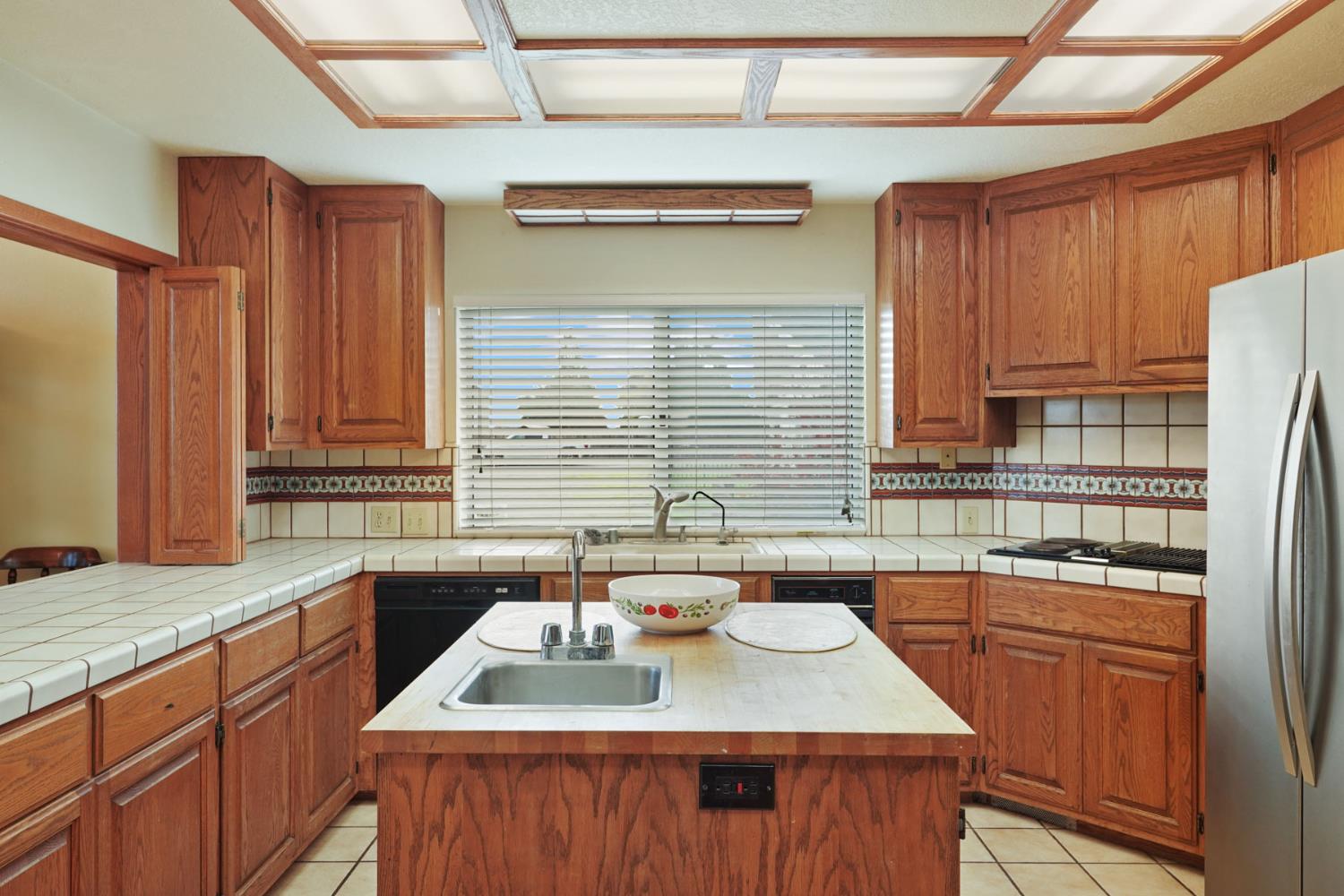 5766 Alpine Road Stockton, CA 95215 - Photo 55 of 99 a kitchen with stainless steel appliances granite countertop a sink stove and cabinets
