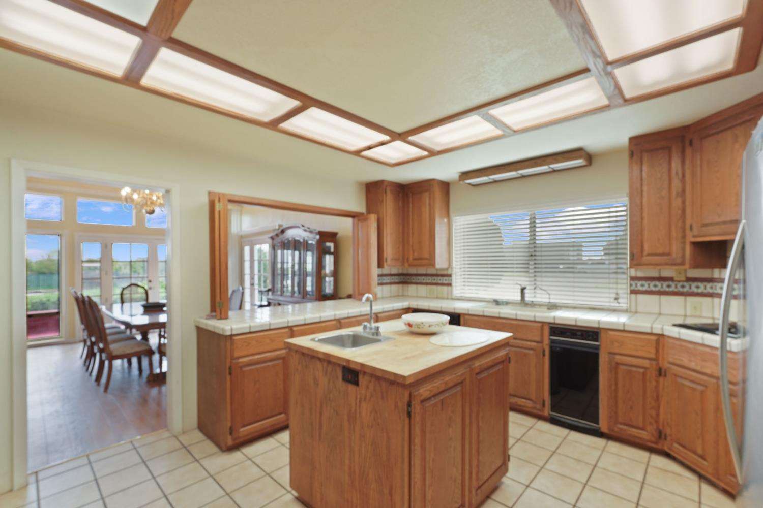 5766 Alpine Road Stockton, CA 95215 - Photo 56 of 99 a kitchen with a sink stove and cabinets