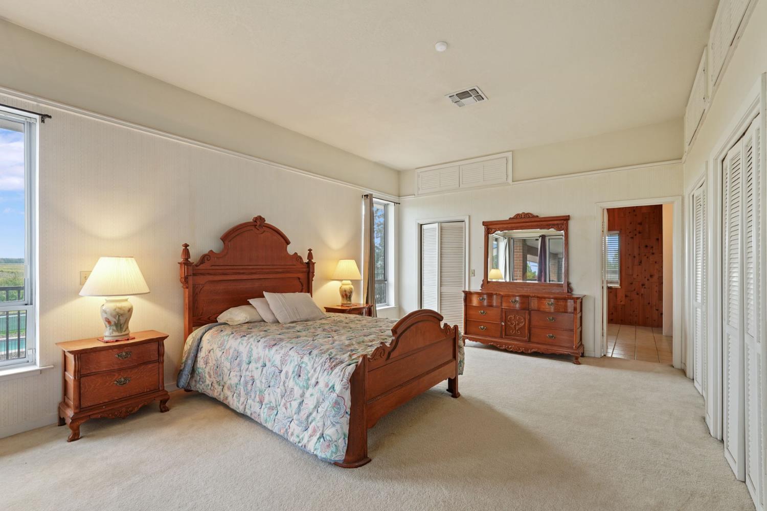 5766 Alpine Road Stockton, CA 95215 - Photo 74 of 99 a bedroom with a bed and a dresser