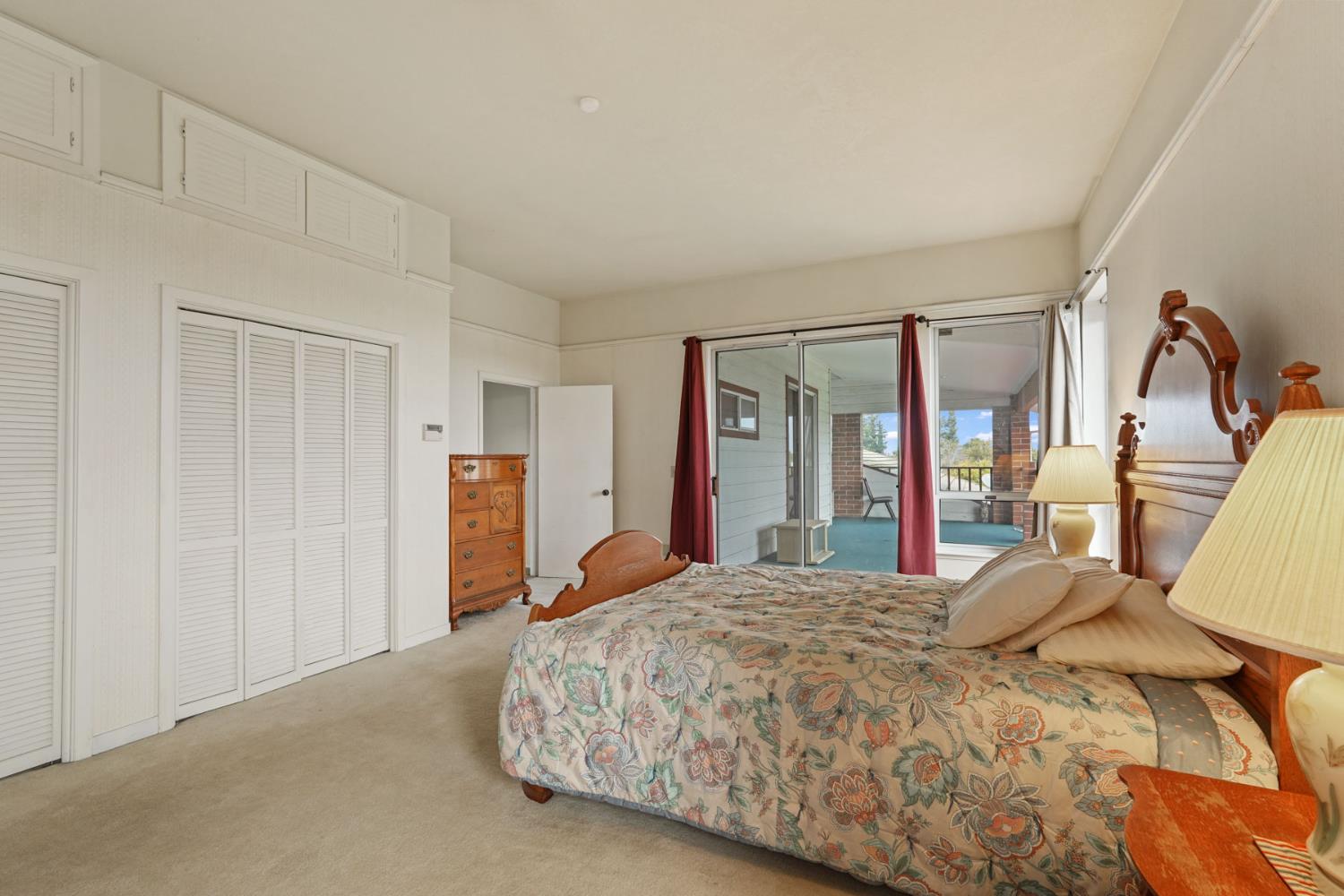 5766 Alpine Road Stockton, CA 95215 - Photo 75 of 99 a bedroom with a bed and a mirror