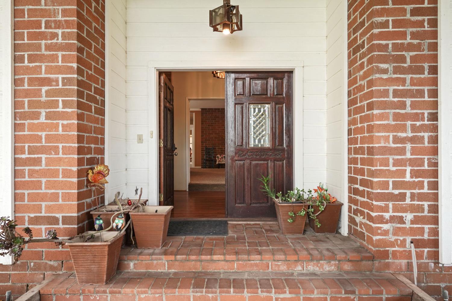 5766 Alpine Road Stockton, CA 95215 - Photo 80 of 99 a view of a entryway door of the house