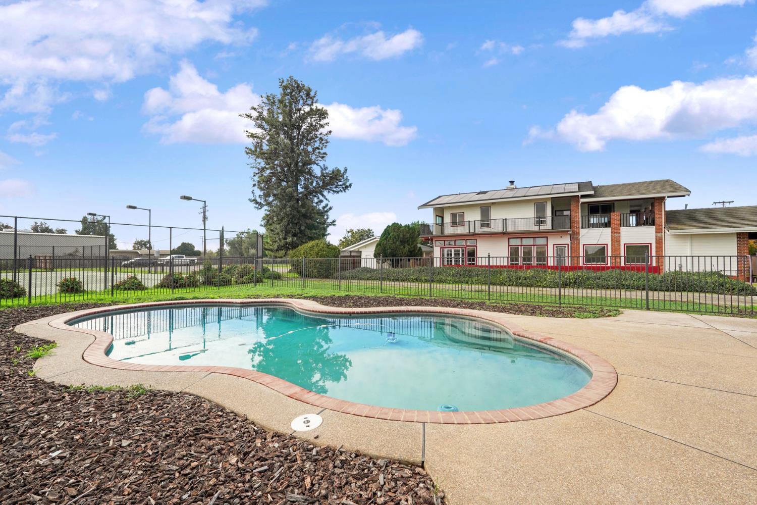 5766 Alpine Road Stockton, CA 95215 - Photo 89 of 99 a view of a house with a swimming pool