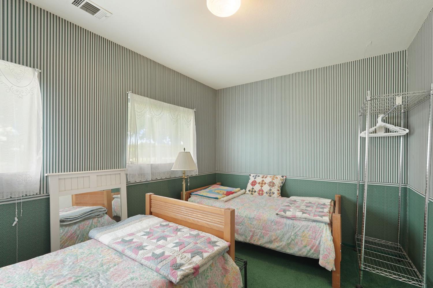 5766 Alpine Road Stockton, CA 95215 - Photo 96 of 99 a bedroom with a bed and a window