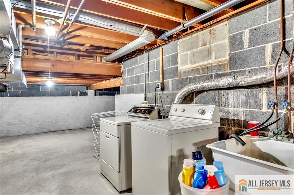 93 Remmey Street Fords, NJ 08863 - Photo 22 of 27 a utility room with dryer and washer