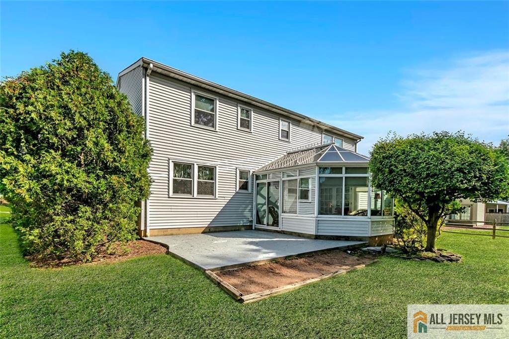 93 Remmey Street Fords, NJ 08863 - Photo 24 of 27 a view of backyard with a garden and trees
