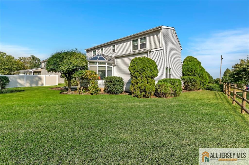 93 Remmey Street Fords, NJ 08863 - Photo 25 of 27 a front view of house with garden and trees