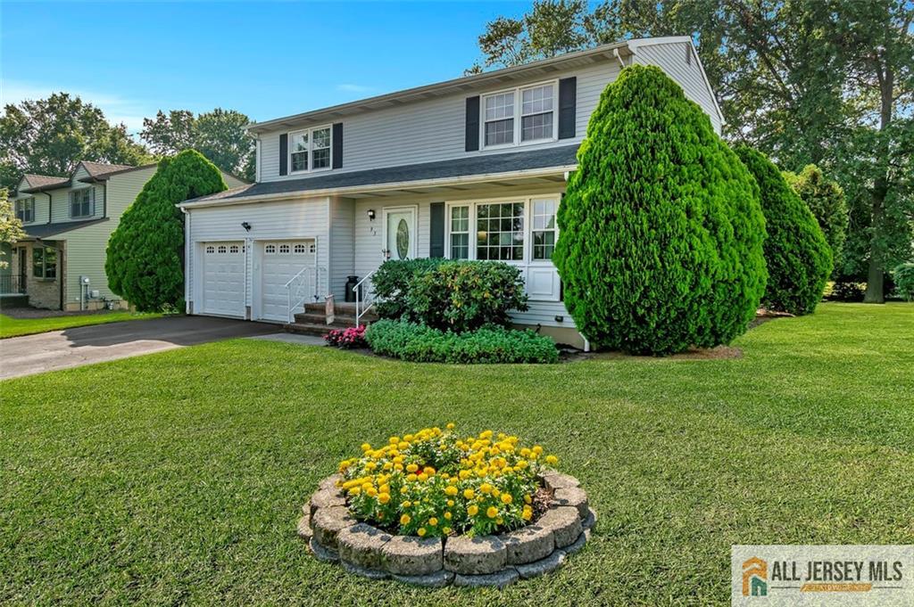 93 Remmey Street Fords, NJ 08863 - Photo 3 of 27 a view of a house with a backyard and garden