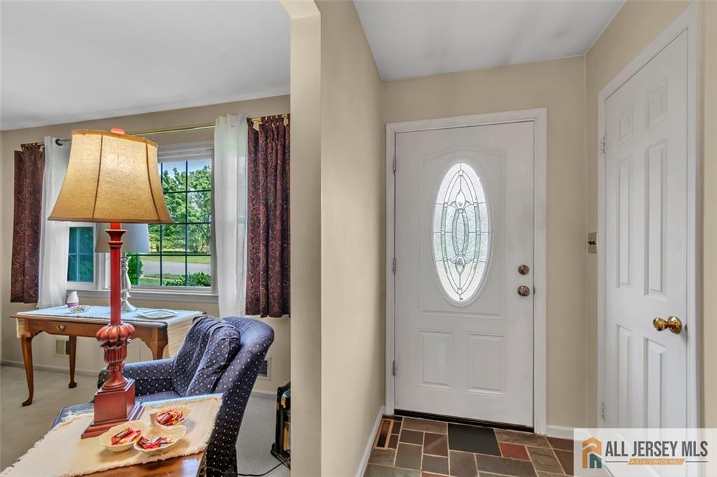 93 Remmey Street Fords, NJ 08863 - Photo 4 of 27 a view of hall way with furniture and a window