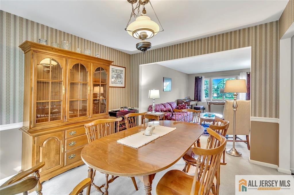 93 Remmey Street Fords, NJ 08863 - Photo 8 of 27 a view of a dining room with furniture wooden floor and chandelier