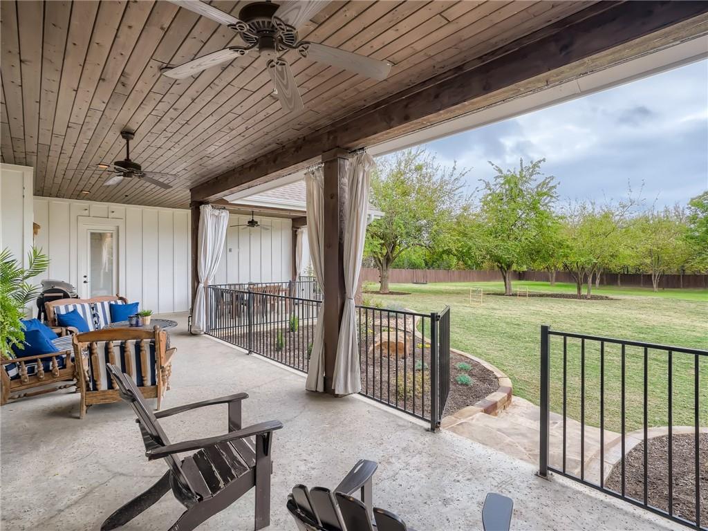 132 Huerta Road Florence, TX 76527 - Photo 28 of 40 A spacious covered patio invites relaxation with views of a verdant backyard, perfect for outdoor gatherings.