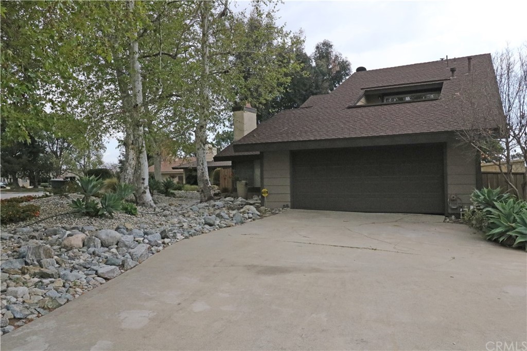 712 Earlham Drive Claremont, CA 91711 - Photo 2 of 14 a house with trees in front of it
