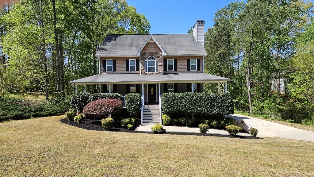 147 Oliver Drive Dallas, GA 30132 - Photo 1 of 55 a front view of a house with a yard and garage