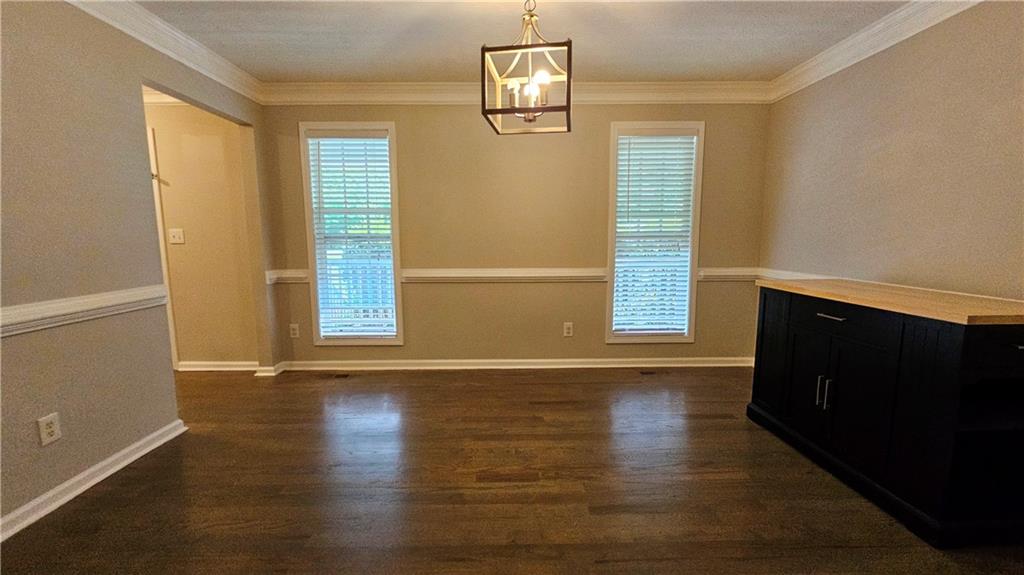 147 Oliver Drive Dallas, GA 30132 - Photo 13 of 55 an empty room with wooden floor and windows