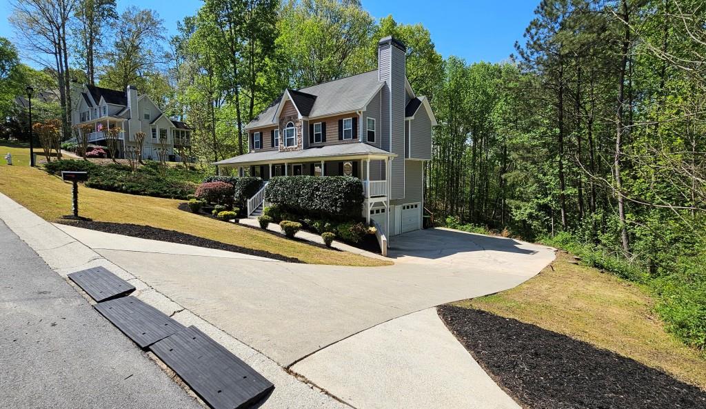 147 Oliver Drive Dallas, GA 30132 - Photo 2 of 55 front view of house with a yard