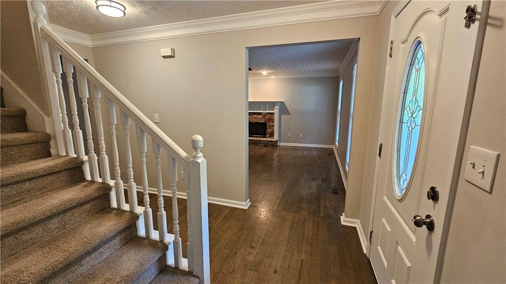 147 Oliver Drive Dallas, GA 30132 - Photo 23 of 55 a view of a hallway with wooden floor and staircase