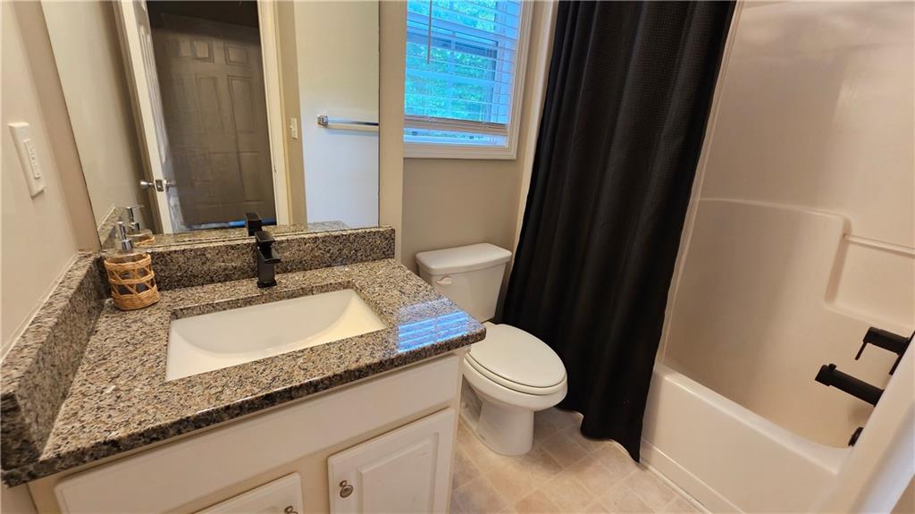 147 Oliver Drive Dallas, GA 30132 - Photo 35 of 55 a bathroom with a granite countertop sink and a mirror