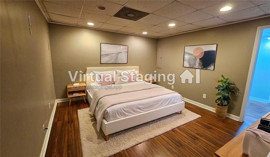 147 Oliver Drive Dallas, GA 30132 - Photo 39 of 55 a bedroom with a bed and wooden floor