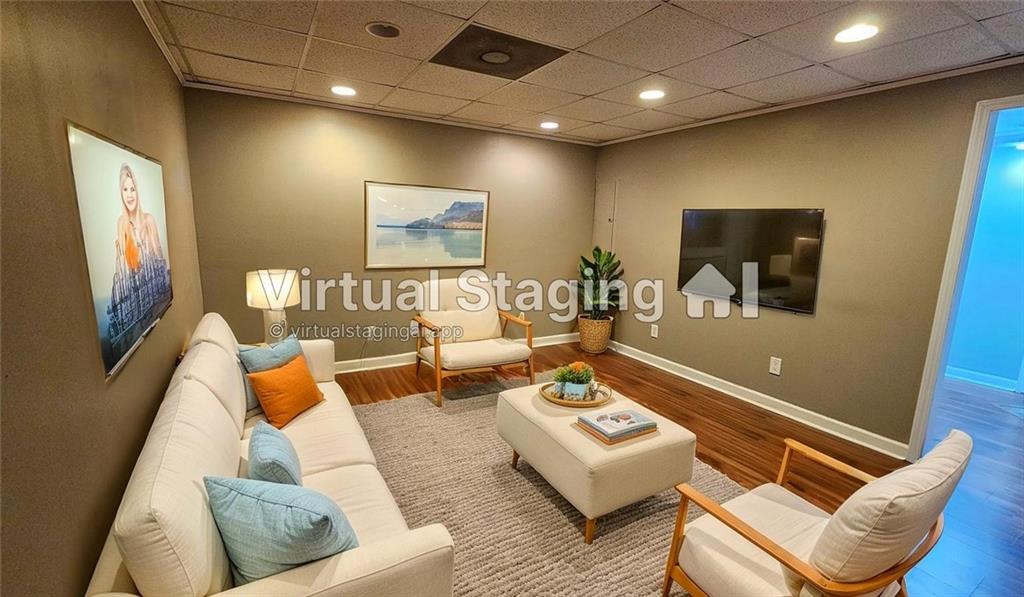 147 Oliver Drive Dallas, GA 30132 - Photo 40 of 55 a living room with furniture and a flat screen tv