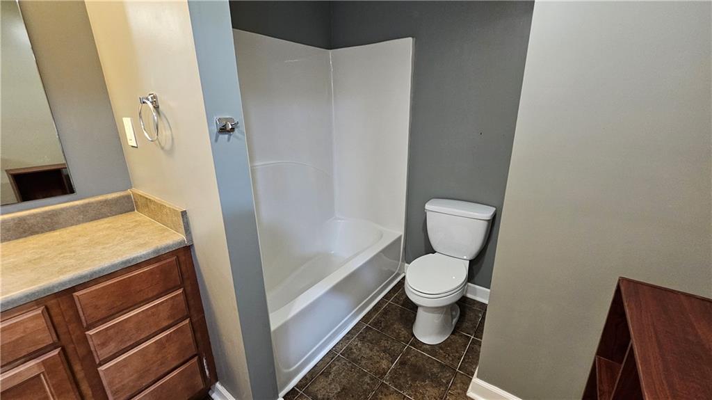 147 Oliver Drive Dallas, GA 30132 - Photo 42 of 55 a bathroom with a granite countertop toilet and a sink