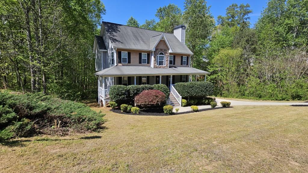 147 Oliver Drive Dallas, GA 30132 - Photo 45 of 55 a view of a house with a yard and sitting area