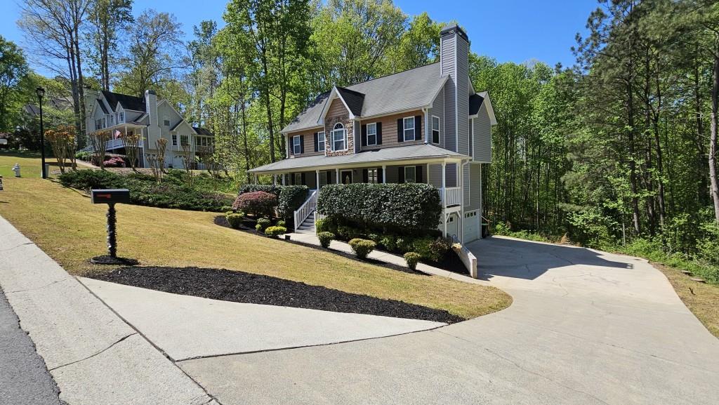 147 Oliver Drive Dallas, GA 30132 - Photo 46 of 55 a view of a house with backyard and sitting area