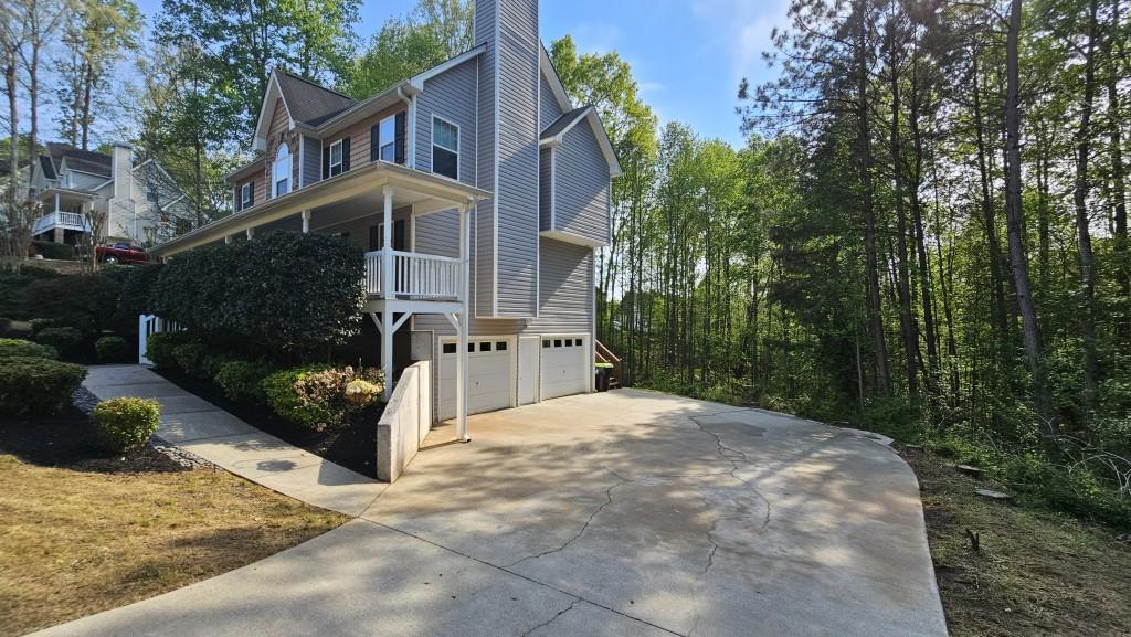 147 Oliver Drive Dallas, GA 30132 - Photo 47 of 55 a front view of a house with garden