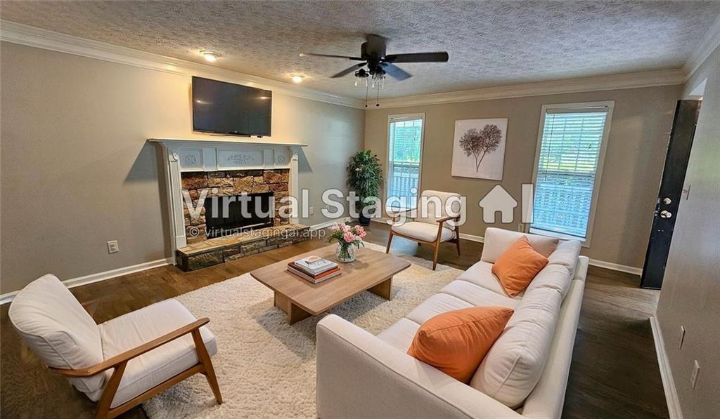 147 Oliver Drive Dallas, GA 30132 - Photo 7 of 55 a living room with furniture a fireplace and a flat screen tv