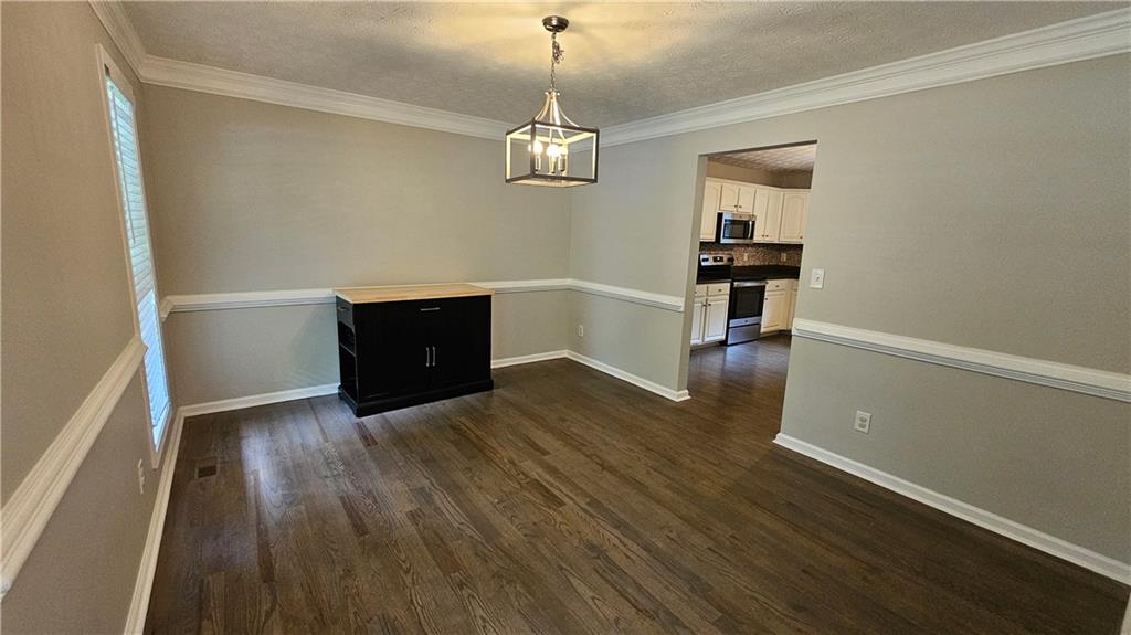 147 Oliver Drive Dallas, GA 30132 - Photo 8 of 55 a view of empty room with wooden floor