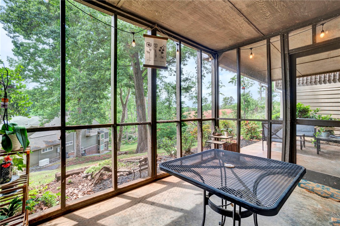 104 Captains Way Anderson, SC 29625 - Photo 40 of 47 This tranquil screened porch offers verdant views and a peaceful setting for relaxation.