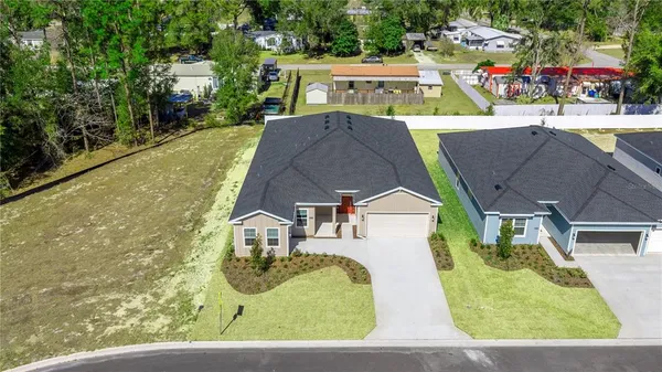 an aerial view of a house with garden