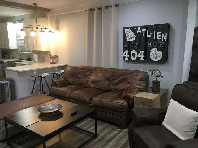 a living room with furniture and a table