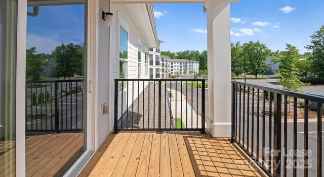 a view of a balcony with wooden floor