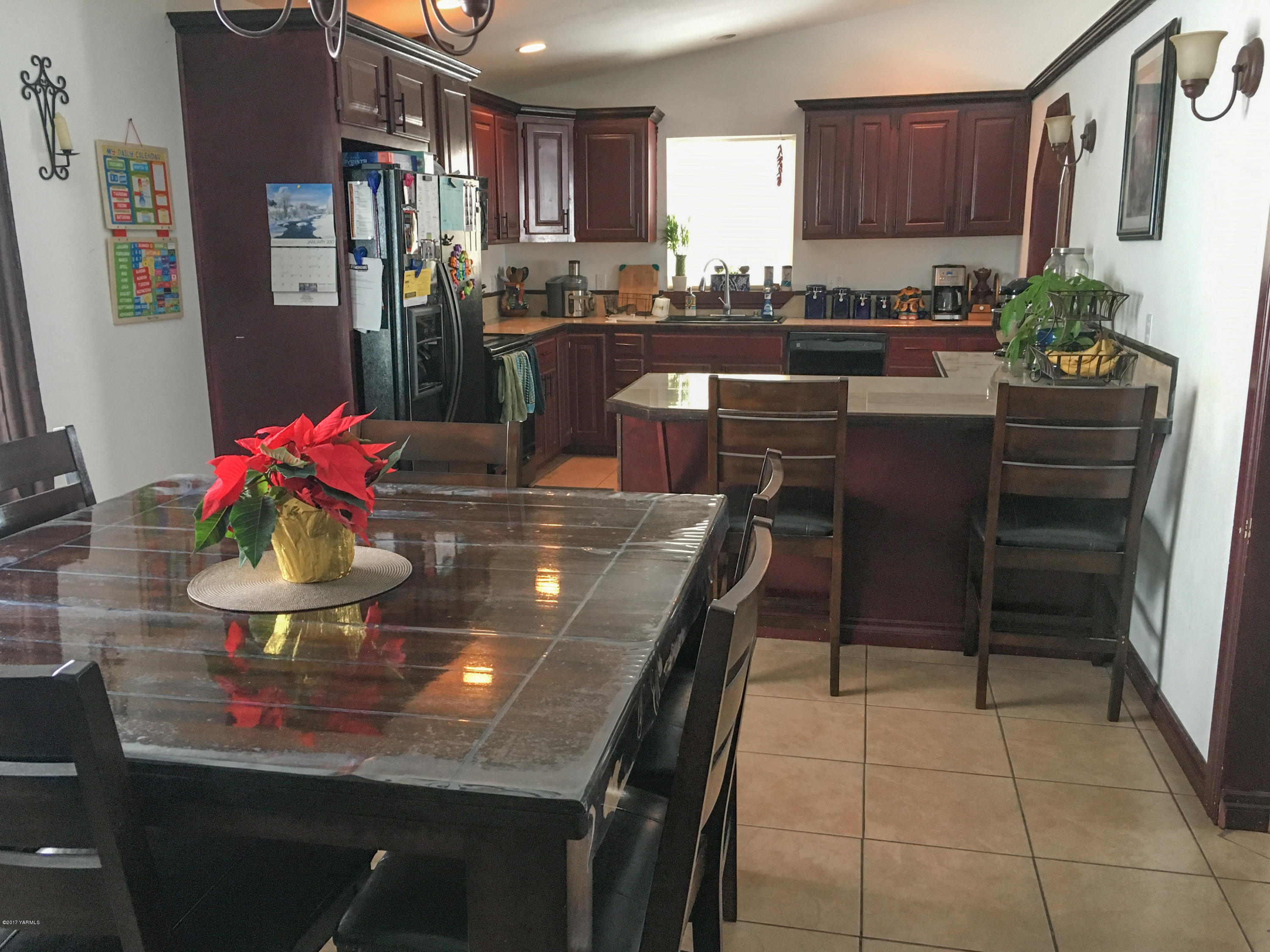 371 West Canyon Road Yakima, WA 98908 - Photo 2 of 10 a kitchen with stainless steel appliances granite countertop a sink dishwasher and cabinets