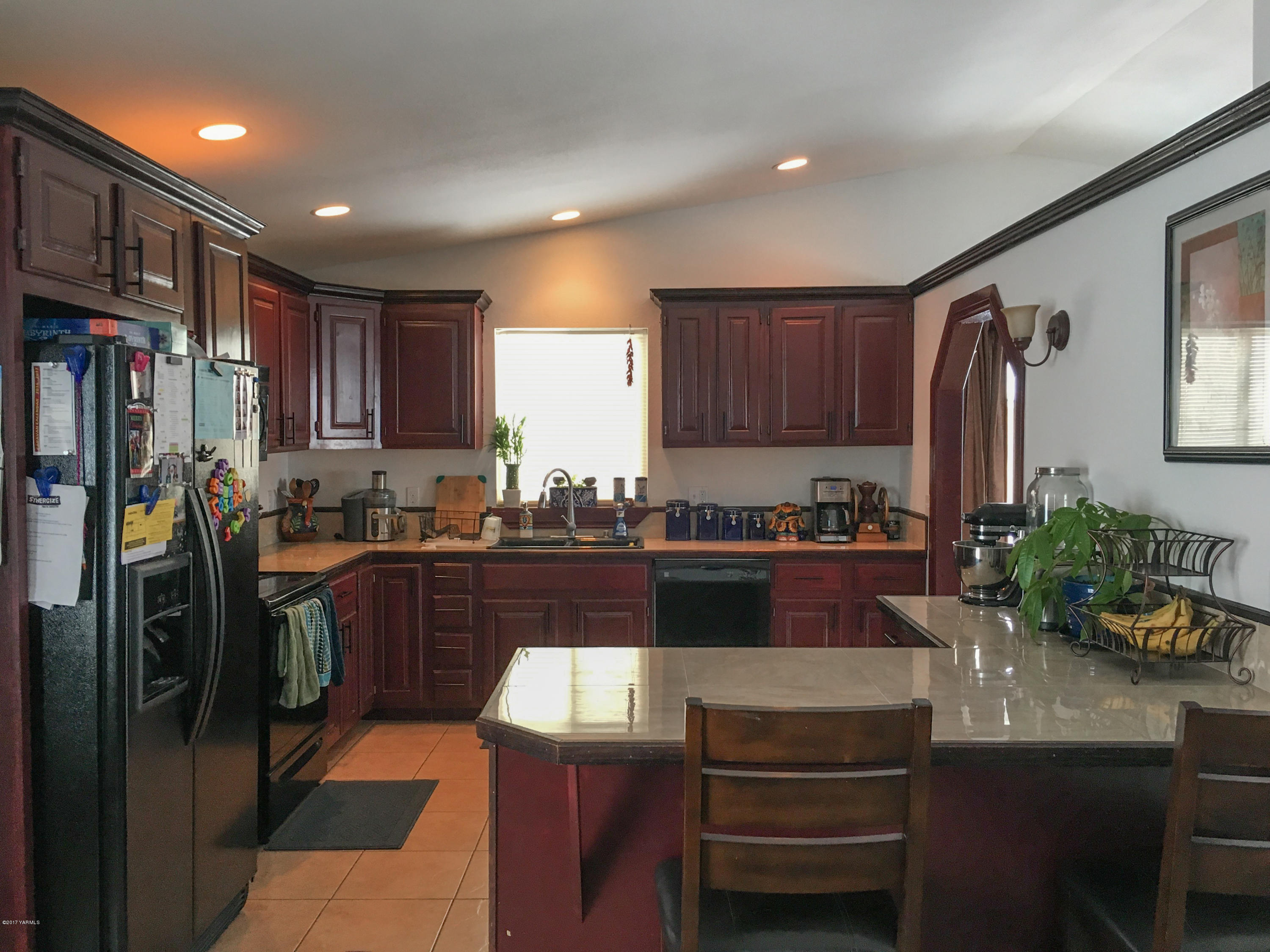371 West Canyon Road Yakima, WA 98908 - Photo 3 of 10 a kitchen with stainless steel appliances granite countertop a refrigerator and a stove top oven