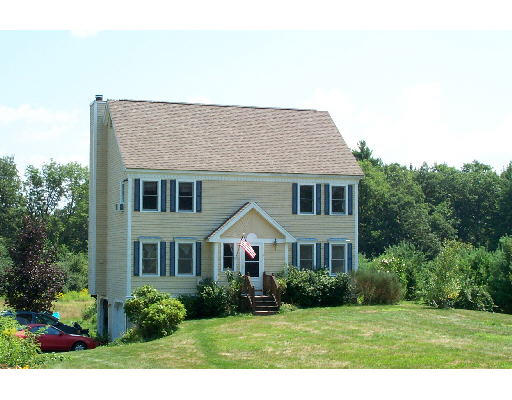 8 Powhatan Road Pepperell, MA 01463 - Photo 1 of 1 a front view of a house with a yard