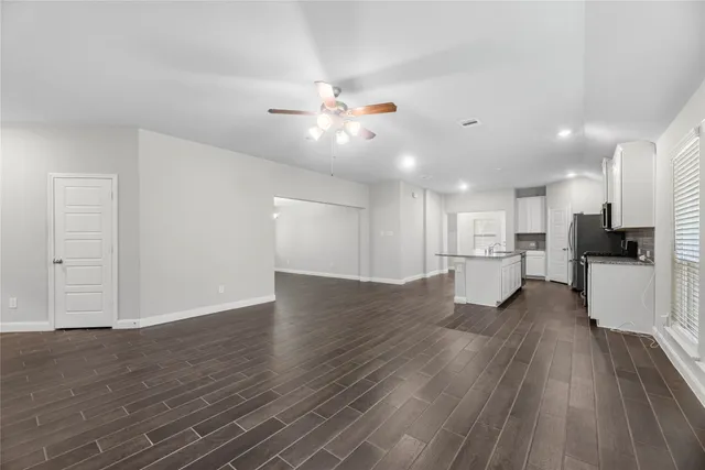 a view of kitchen with wooden floor and window
