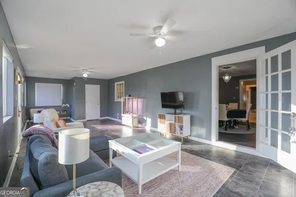 a living room with furniture and a flat screen tv