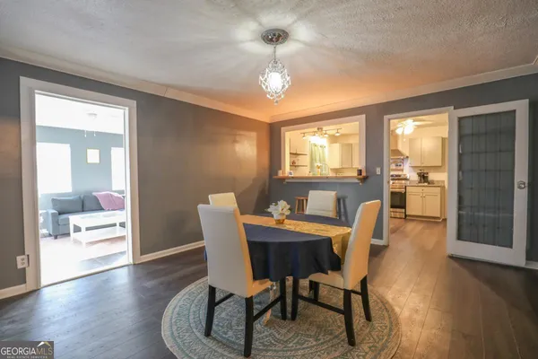a view of a dining room with furniture window and wooden floor