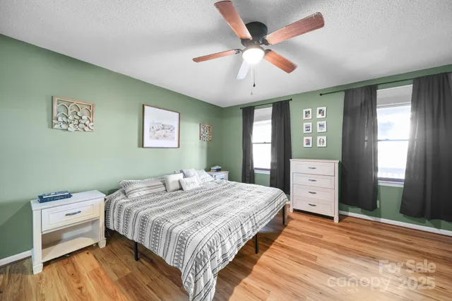 a bedroom with a bed and a view of bedroom