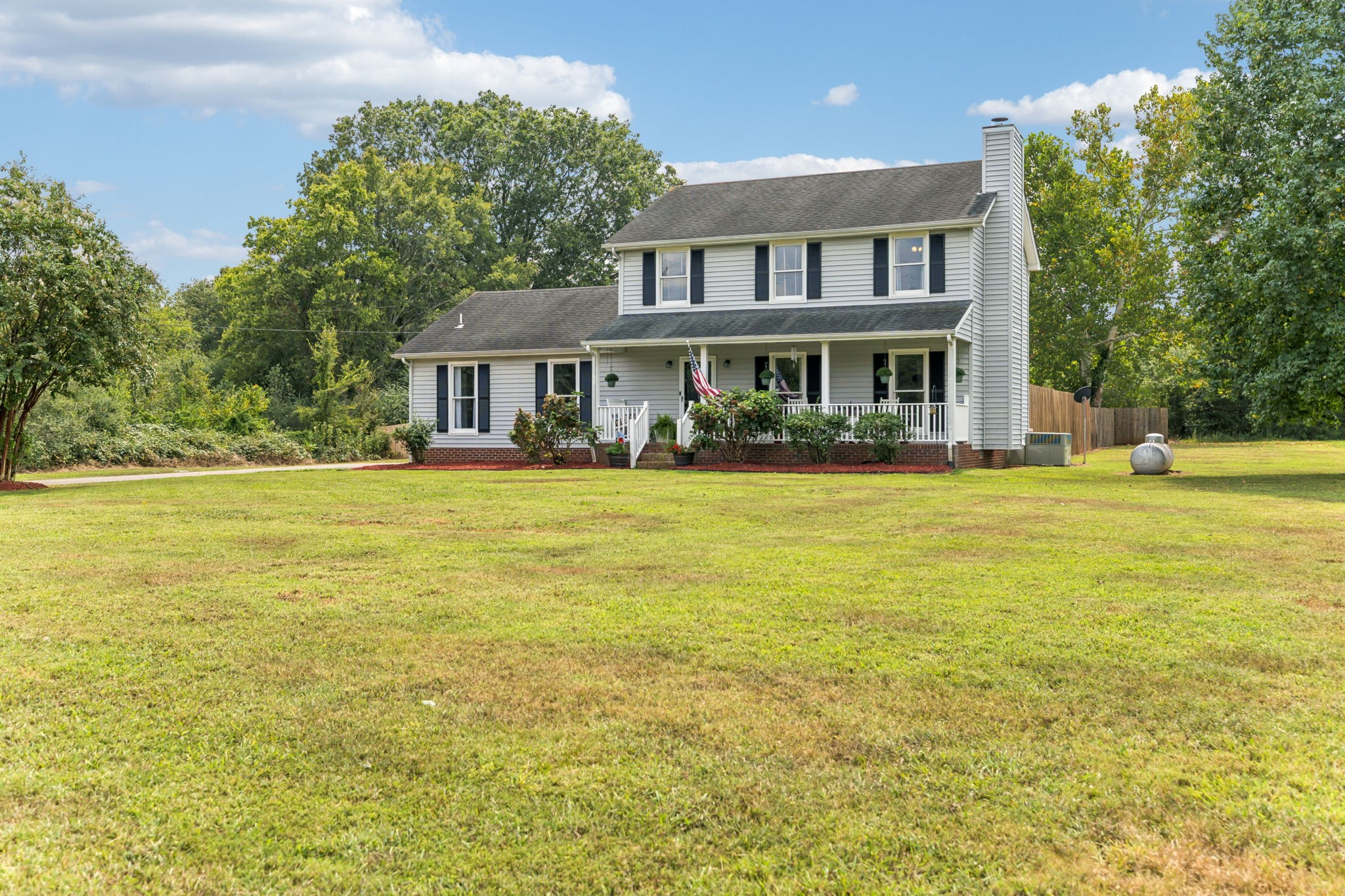 4011 Central Valley Road Murfreesboro, TN 37129 - Photo 29 of 43 a view of a house with a big yard and large trees