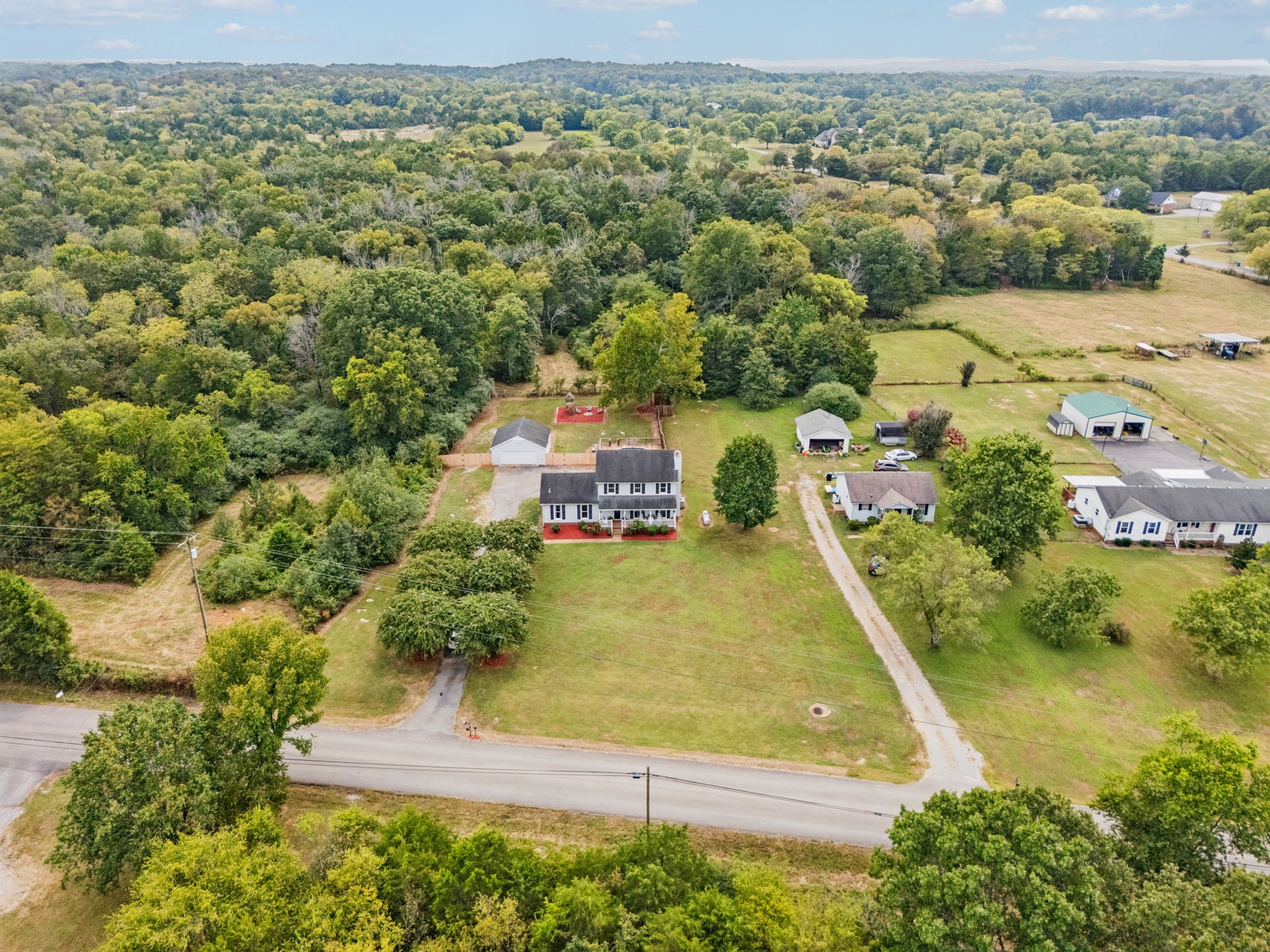 4011 Central Valley Road Murfreesboro, TN 37129 - Photo 3 of 43 an aerial view of residential houses with outdoor space and trees