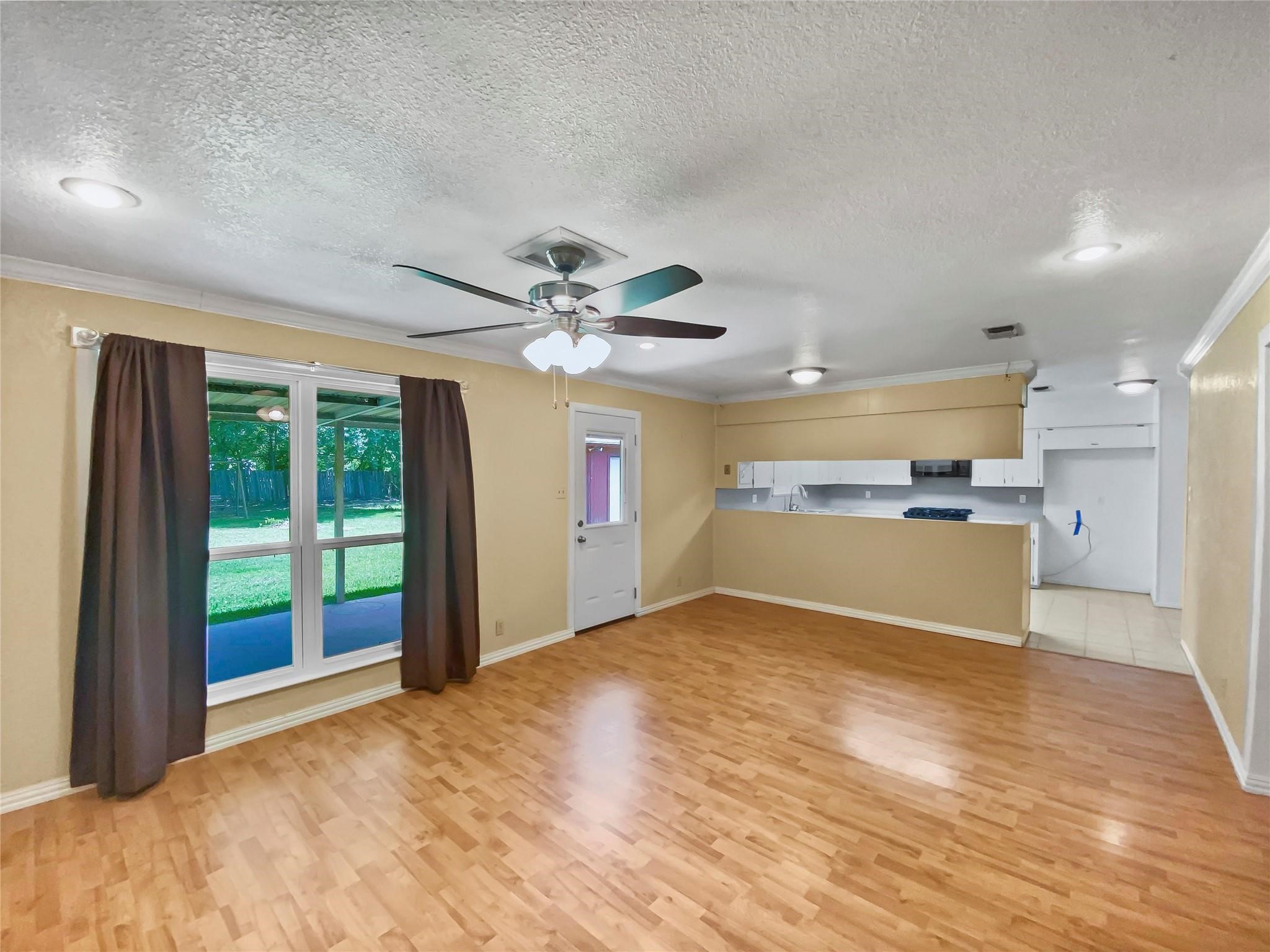 516 Dwyer Street Angleton, TX 77515 - Photo 5 of 18 a view of a kitchen with a sink and a kitchen view