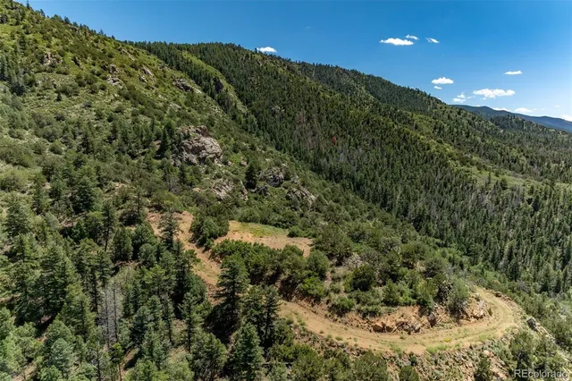 a view of a city with mountains in the background