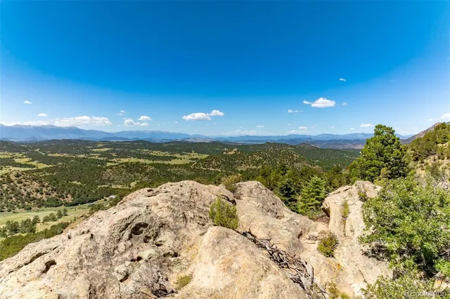 a view of a city with mountains in the background