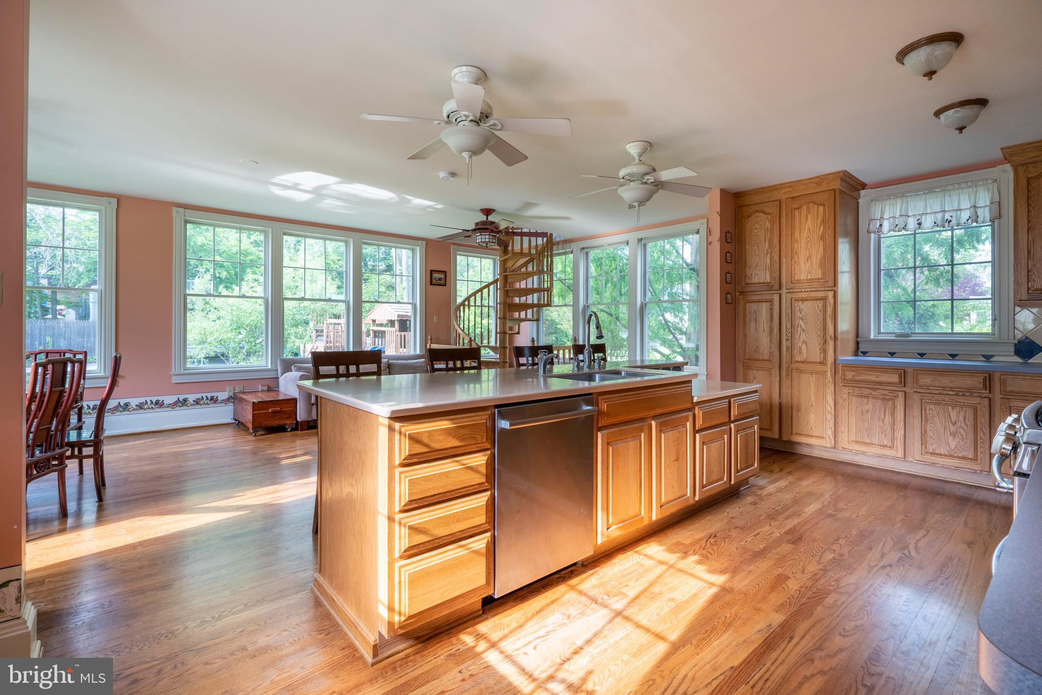 301 Midland Avenue Wayne, PA 19087 - Photo 15 of 63 a large kitchen with kitchen island granite countertop a large window cabinets and stainless steel appliances