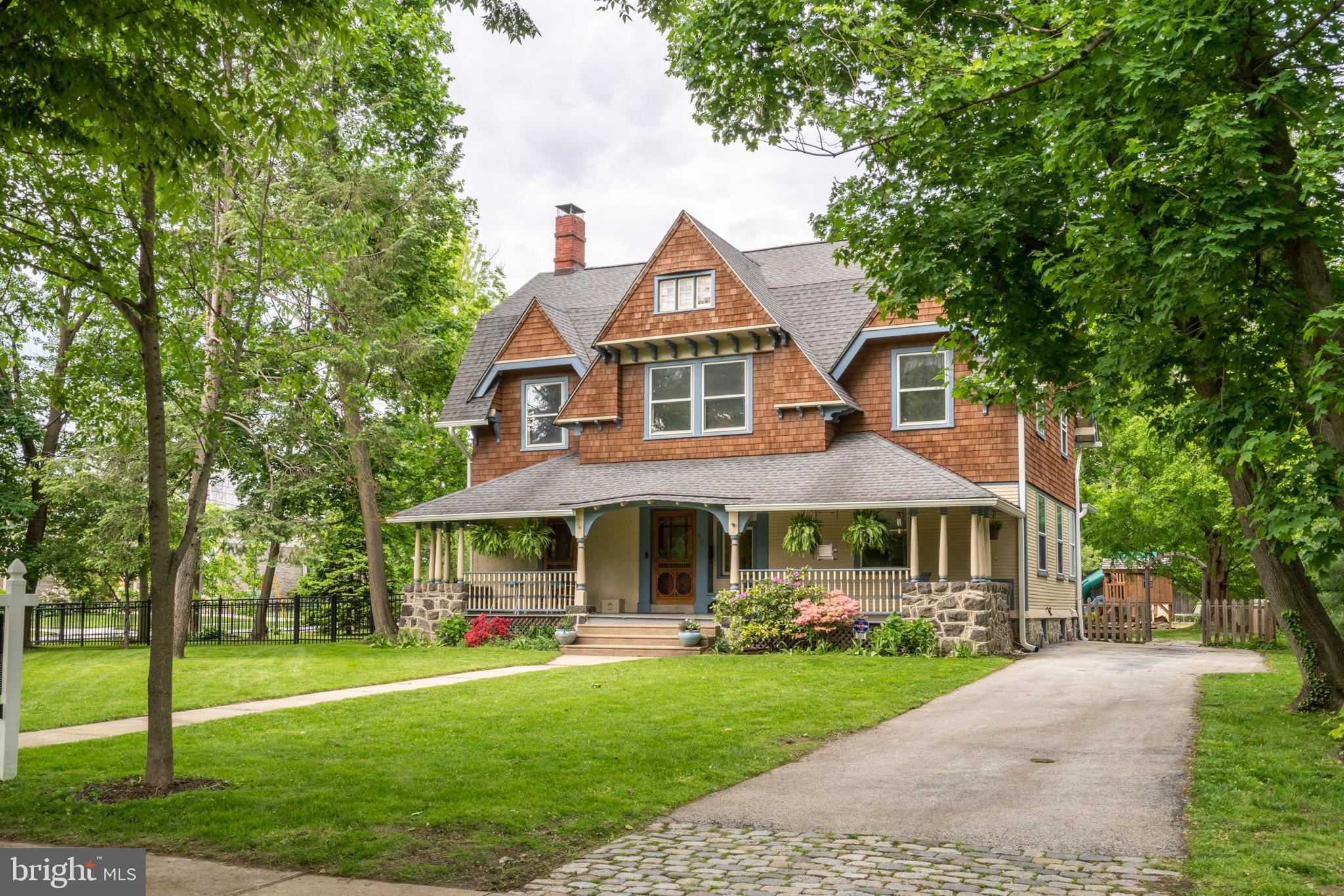 301 Midland Avenue Wayne, PA 19087 - Photo 3 of 63 a front view of a house with a yard
