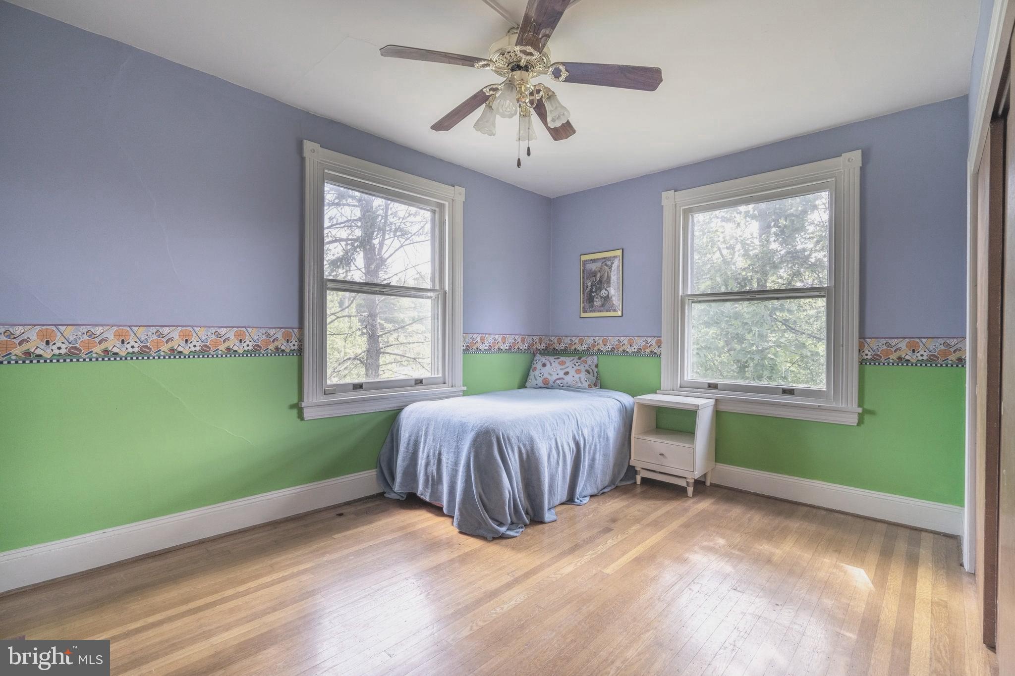 301 Midland Avenue Wayne, PA 19087 - Photo 36 of 63 a bedroom with a bed and windows