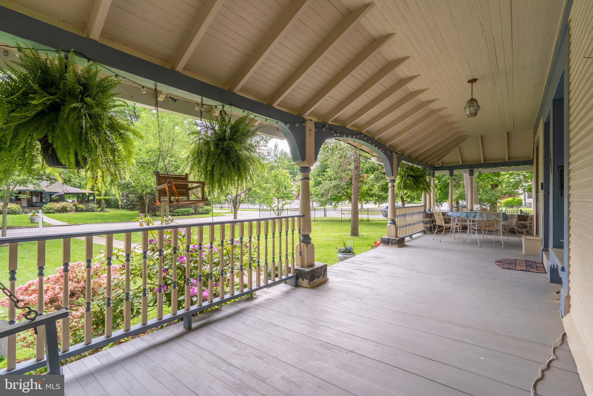 301 Midland Avenue Wayne, PA 19087 - Photo 5 of 63 a view of a swimming pool with a patio and a garden